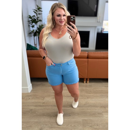 Celeste Mid Rise Shield Pocket Cutoff Shorts in Sky Blue Celeste Mid Rise Shield Pocket Cutoff Shorts in Sky Blue