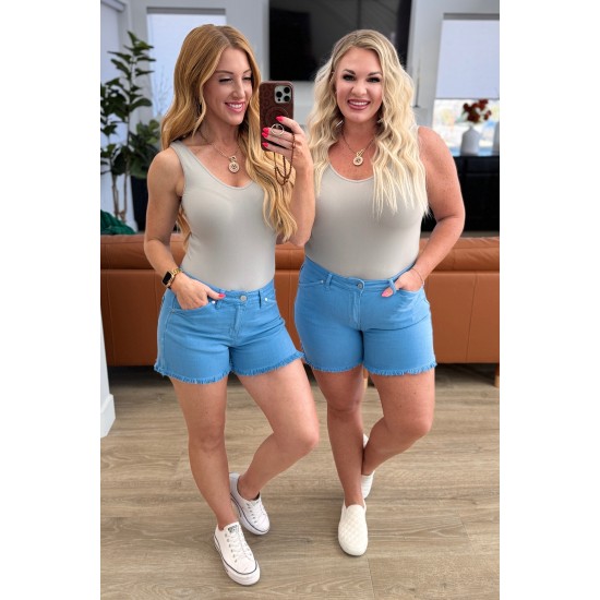 Celeste Mid Rise Shield Pocket Cutoff Shorts in Sky Blue Celeste Mid Rise Shield Pocket Cutoff Shorts in Sky Blue